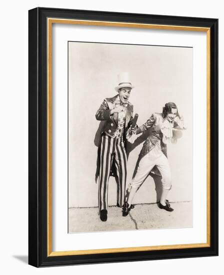 Two People in 18th Century Costumes Playing with Firecrackers-null-Framed Photo