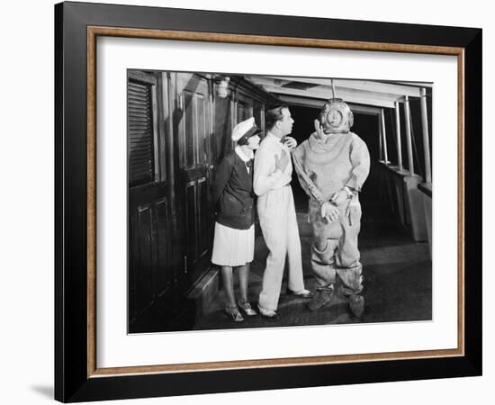 Two People Looking in Shock at a Diver in a Divers Suit-null-Framed Photo