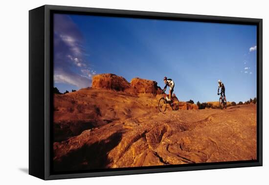 Two people mountain biking, Moab, Utah, USA-Richard Sisk-Framed Premier Image Canvas