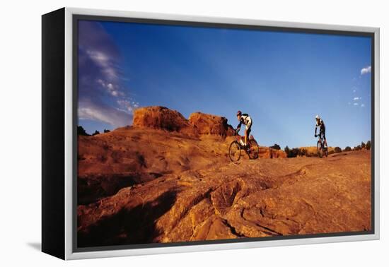 Two people mountain biking, Moab, Utah, USA-Richard Sisk-Framed Premier Image Canvas