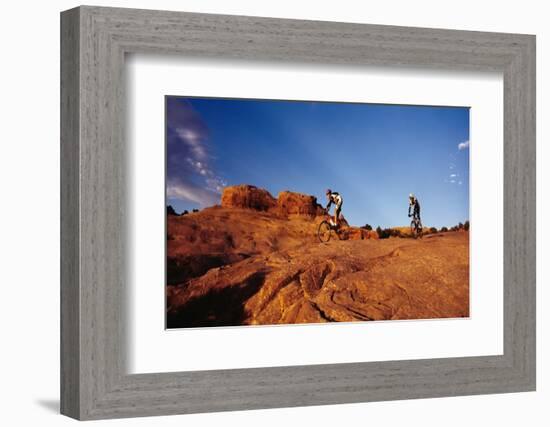 Two people mountain biking, Moab, Utah, USA-Richard Sisk-Framed Photographic Print