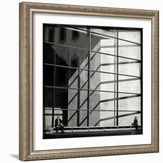 Two People Sitting Outside a Modern Glass Building-Eudald Castells-Framed Photographic Print