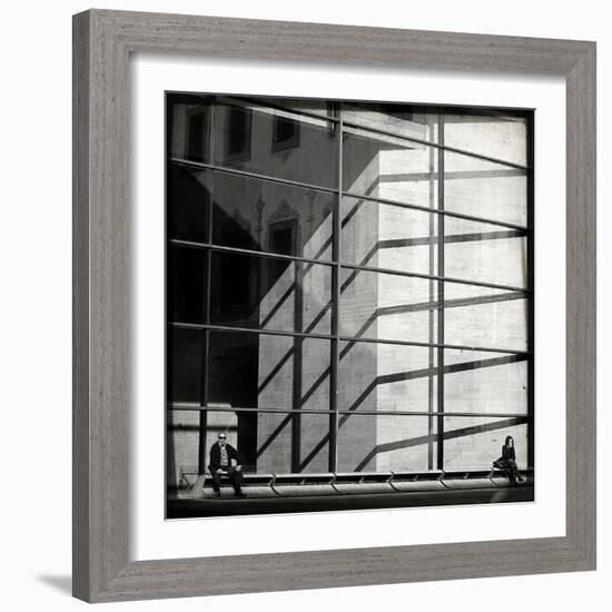 Two People Sitting Outside a Modern Glass Building-Eudald Castells-Framed Photographic Print