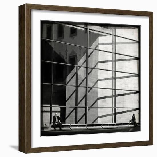 Two People Sitting Outside a Modern Glass Building-Eudald Castells-Framed Photographic Print