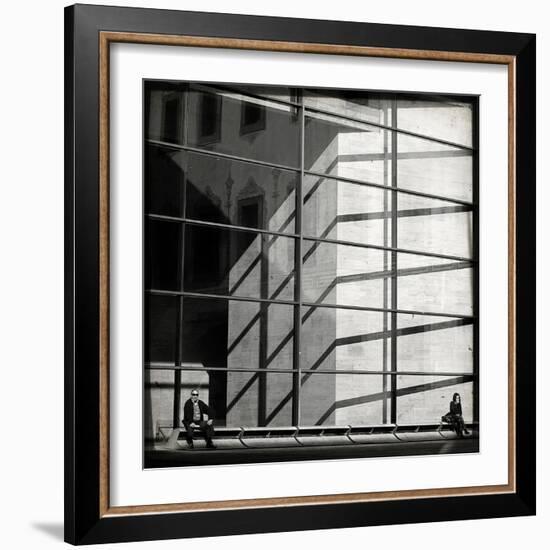 Two People Sitting Outside a Modern Glass Building-Eudald Castells-Framed Photographic Print