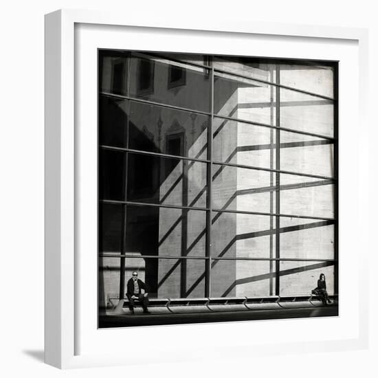 Two People Sitting Outside a Modern Glass Building-Eudald Castells-Framed Photographic Print