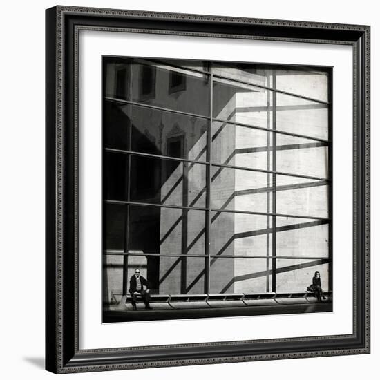 Two People Sitting Outside a Modern Glass Building-Eudald Castells-Framed Photographic Print