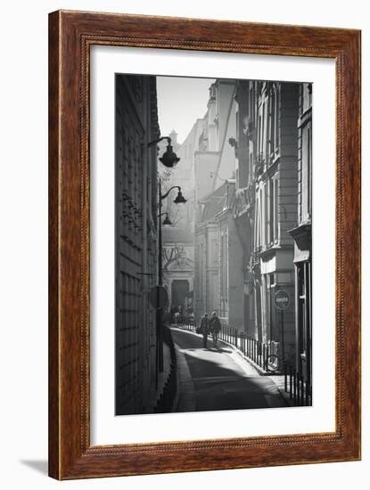 Two People Walking Up Sunny Side Street Near St Michel Notre Dame in Paris, France-Robert Such-Framed Photographic Print