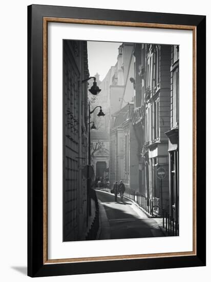 Two People Walking Up Sunny Side Street Near St Michel Notre Dame in Paris, France-Robert Such-Framed Photographic Print