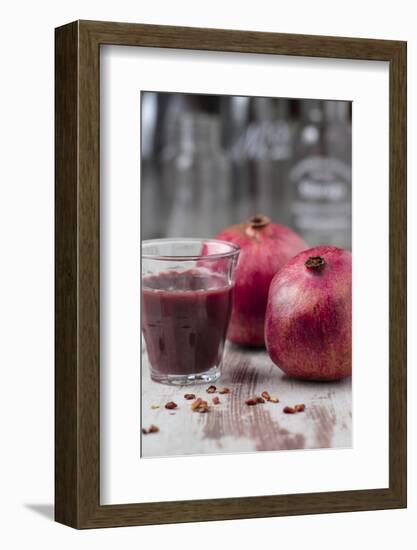 Two Pomegranates and Glass with Pomegranate Juice, Close-Up-Jana Ihle-Framed Photographic Print