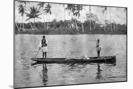 Two Seminole Indians Pole a Canoe on the Miami River, C.1895-null-Mounted Photographic Print