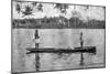 Two Seminole Indians Pole a Canoe on the Miami River, C.1895-null-Mounted Photographic Print