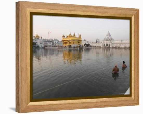 Two Sikh Pilgrims Bathing and Praying in the Early Morning in Holy Pool, Amritsar, India-Eitan Simanor-Framed Premier Image Canvas