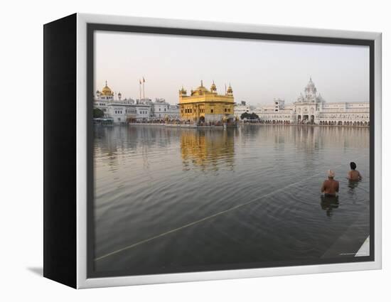 Two Sikh Pilgrims Bathing and Praying in the Early Morning in Holy Pool, Amritsar, India-Eitan Simanor-Framed Premier Image Canvas