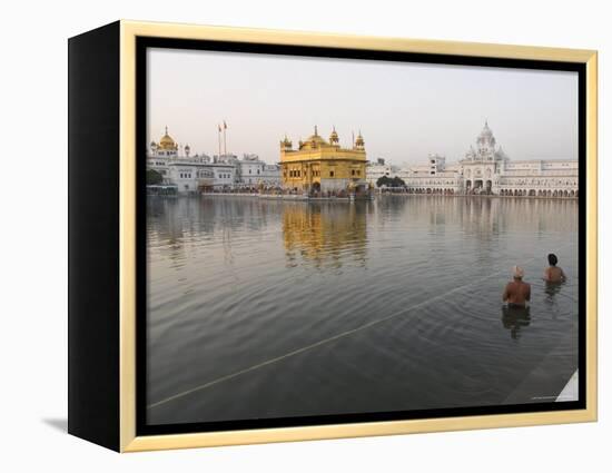 Two Sikh Pilgrims Bathing and Praying in the Early Morning in Holy Pool, Amritsar, India-Eitan Simanor-Framed Premier Image Canvas