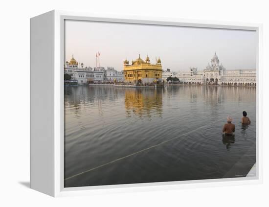 Two Sikh Pilgrims Bathing and Praying in the Early Morning in Holy Pool, Amritsar, India-Eitan Simanor-Framed Premier Image Canvas