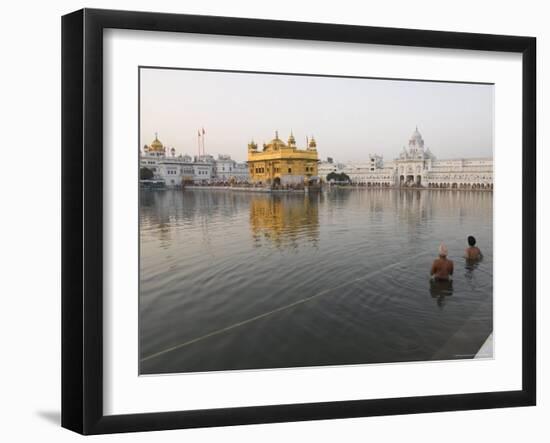 Two Sikh Pilgrims Bathing and Praying in the Early Morning in Holy Pool, Amritsar, India-Eitan Simanor-Framed Photographic Print