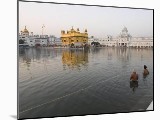 Two Sikh Pilgrims Bathing and Praying in the Early Morning in Holy Pool, Amritsar, India-Eitan Simanor-Mounted Photographic Print