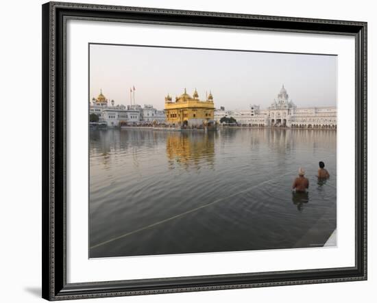 Two Sikh Pilgrims Bathing and Praying in the Early Morning in Holy Pool, Amritsar, India-Eitan Simanor-Framed Photographic Print