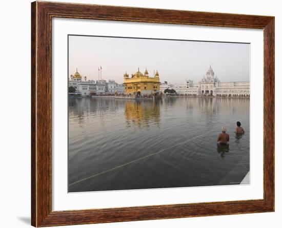 Two Sikh Pilgrims Bathing and Praying in the Early Morning in Holy Pool, Amritsar, India-Eitan Simanor-Framed Photographic Print