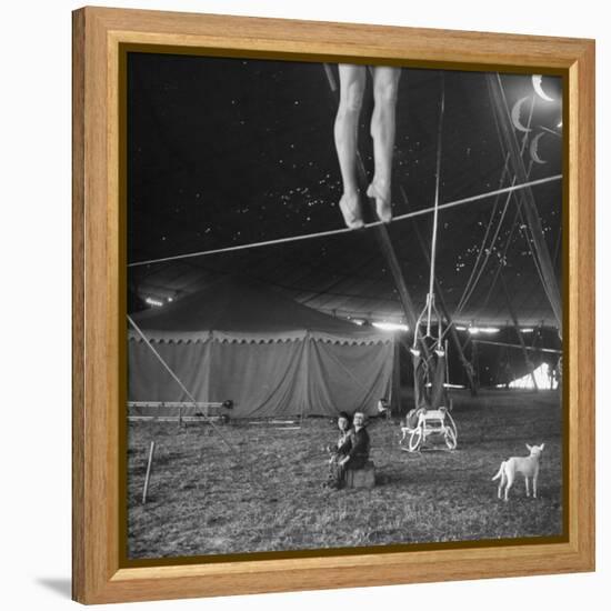 Two Small Children Watching Circus Performer Practicing on Tightrope, Her Legs Only Visible-Nina Leen-Framed Premier Image Canvas