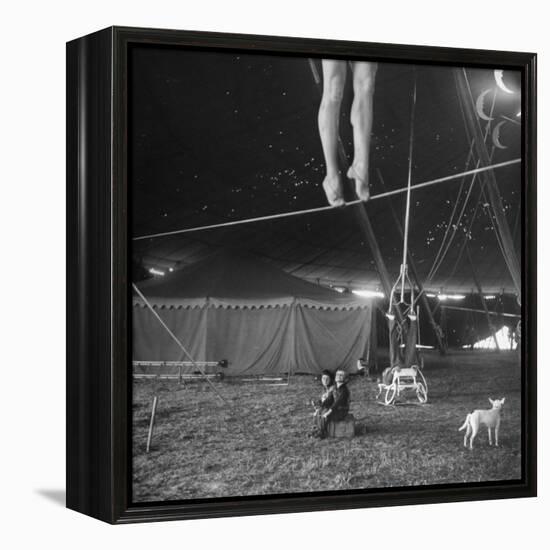 Two Small Children Watching Circus Performer Practicing on Tightrope, Her Legs Only Visible-Nina Leen-Framed Premier Image Canvas