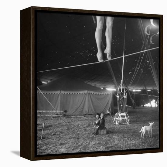 Two Small Children Watching Circus Performer Practicing on Tightrope, Her Legs Only Visible-Nina Leen-Framed Premier Image Canvas