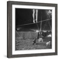 Two Small Children Watching Circus Performer Practicing on Tightrope, Her Legs Only Visible-Nina Leen-Framed Photographic Print