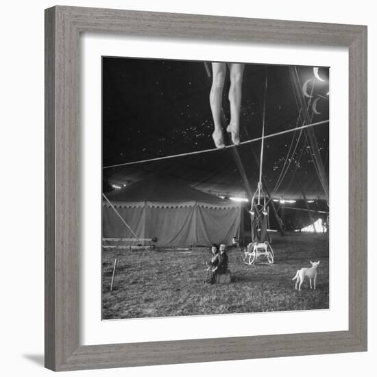 Two Small Children Watching Circus Performer Practicing on Tightrope, Her Legs Only Visible-Nina Leen-Framed Photographic Print