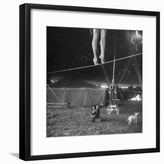 Two Small Children Watching Circus Performer Practicing on Tightrope, Her Legs Only Visible-Nina Leen-Framed Photographic Print