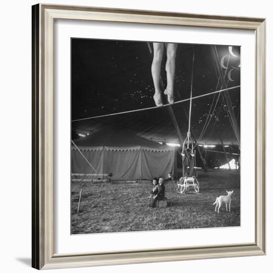 Two Small Children Watching Circus Performer Practicing on Tightrope, Her Legs Only Visible-Nina Leen-Framed Photographic Print