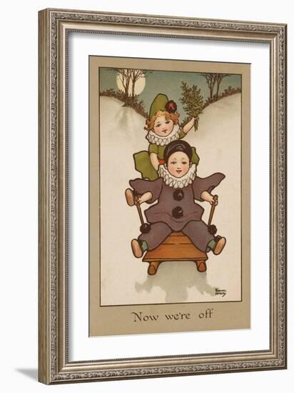 Two Small Children, Wearing Clown and Pierrot Costumes Have Fun in the Snow on a Sledge-null-Framed Art Print