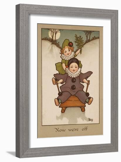 Two Small Children, Wearing Clown and Pierrot Costumes Have Fun in the Snow on a Sledge-null-Framed Art Print