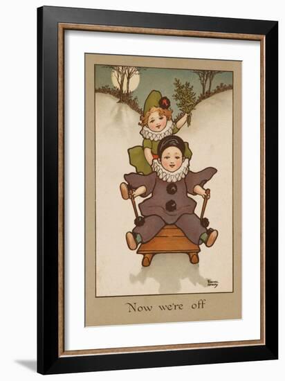 Two Small Children, Wearing Clown and Pierrot Costumes Have Fun in the Snow on a Sledge-null-Framed Art Print