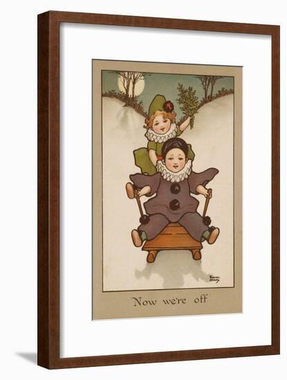 Two Small Children, Wearing Clown and Pierrot Costumes Have Fun in the Snow on a Sledge-null-Framed Art Print