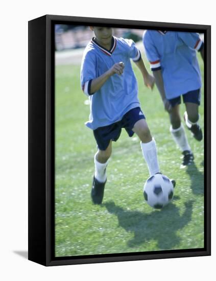 Two Soccer Players Chasing a Soccer Ball-null-Framed Premier Image Canvas