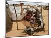 Two Sudanese Women Sit at a Make Shift Hut-null-Mounted Photographic Print