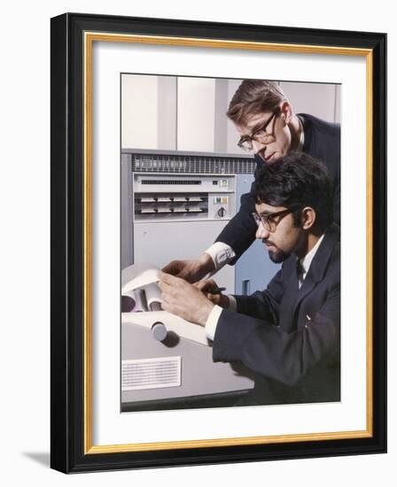 Two Technicians Check a Computer Printout-Heinz Zinram-Framed Photographic Print