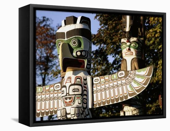 Two Totem Poles, Stanley Park, Vancouver, British Columbia, Canada-Walter Bibikow-Framed Premier Image Canvas