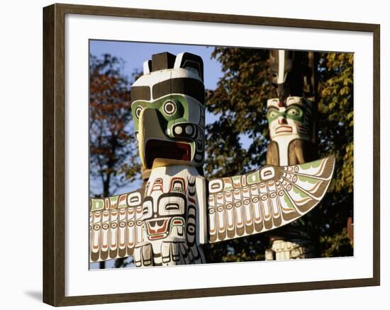 Two Totem Poles, Stanley Park, Vancouver, British Columbia, Canada-Walter Bibikow-Framed Photographic Print