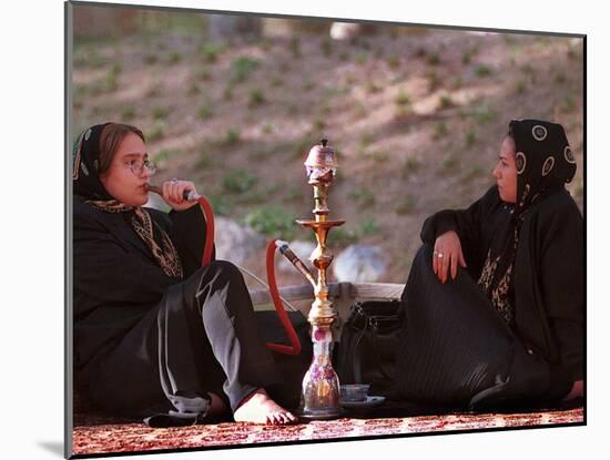 Two Unidentified Iranian Women Smoke a Water Pipe-null-Mounted Photographic Print
