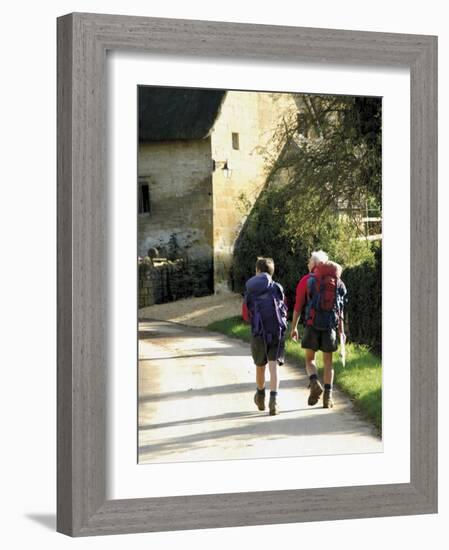 Two Walkers with Rucksacks on the Cotswold Way Footpath, Stanton Village, the Cotswolds, England-David Hughes-Framed Photographic Print