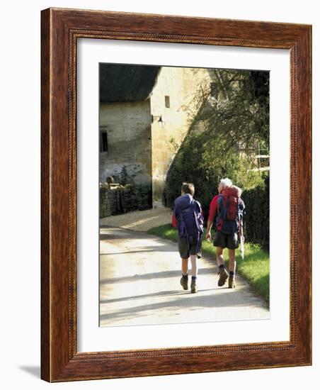 Two Walkers with Rucksacks on the Cotswold Way Footpath, Stanton Village, the Cotswolds, England-David Hughes-Framed Photographic Print