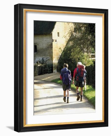 Two Walkers with Rucksacks on the Cotswold Way Footpath, Stanton Village, the Cotswolds, England-David Hughes-Framed Photographic Print