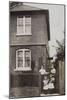 Two Women and Two Girls Outside a Semi-Detached House-null-Mounted Photographic Print