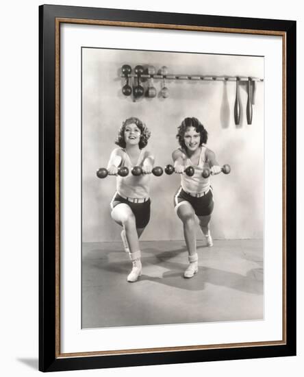 Two Women Exercising with Dumbbells at Gym-null-Framed Photo