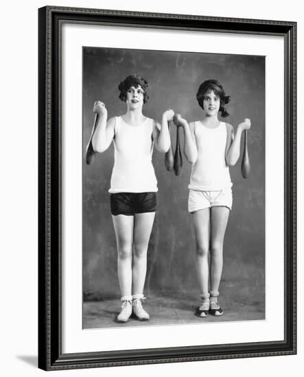 Two Women Exercising with Juggling Pins-null-Framed Photo