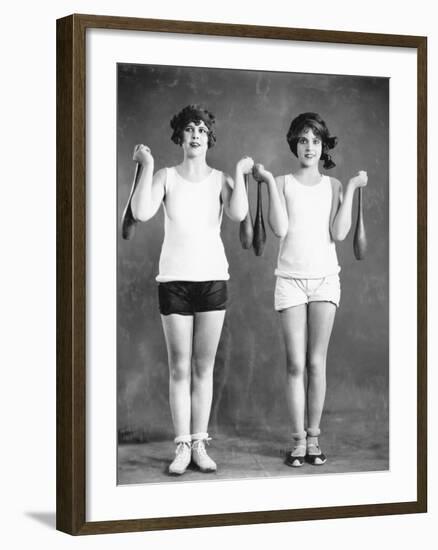 Two Women Exercising with Juggling Pins-null-Framed Photo