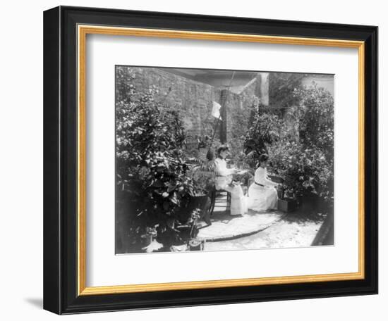 Two Women in their Garden in Cuba Photograph - Cuba-Lantern Press-Framed Art Print