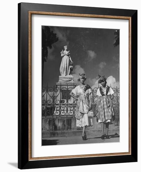 Two Women Standing in Front of a Statue of the Empress Josephine on the Island of Martinique-null-Framed Photographic Print